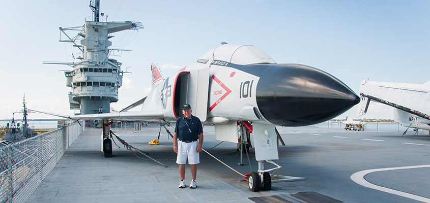 RADM Flatley standing in front of an F4 on the deck of the Yorktown, the equipment he flew in Vietnam. &copy; 2016 Audra L. Gibson. All Rights Reserved.
