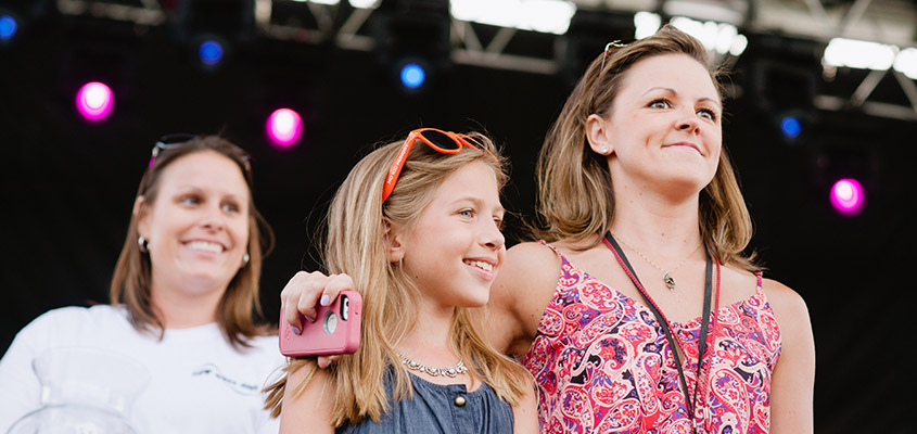 Camp Happy Days reps and families awarding prizes to lucky fans. &copy; 2014 Sally Credle Watts. All Rights Reserved.