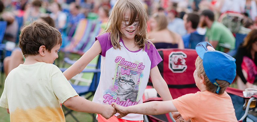 Children enjoy the music and time together at the festival. &copy; 2014 Sally Credle Watts. All Rights Reserved.