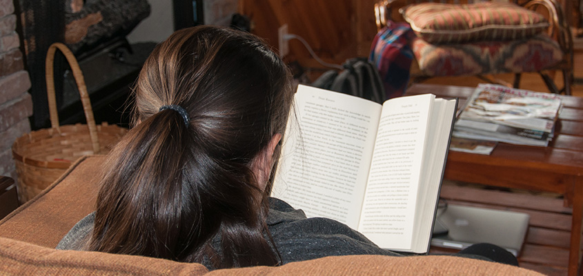 Reading a book at the cabin. &copy; 2016 Audra Gibson. All Rights reserved.